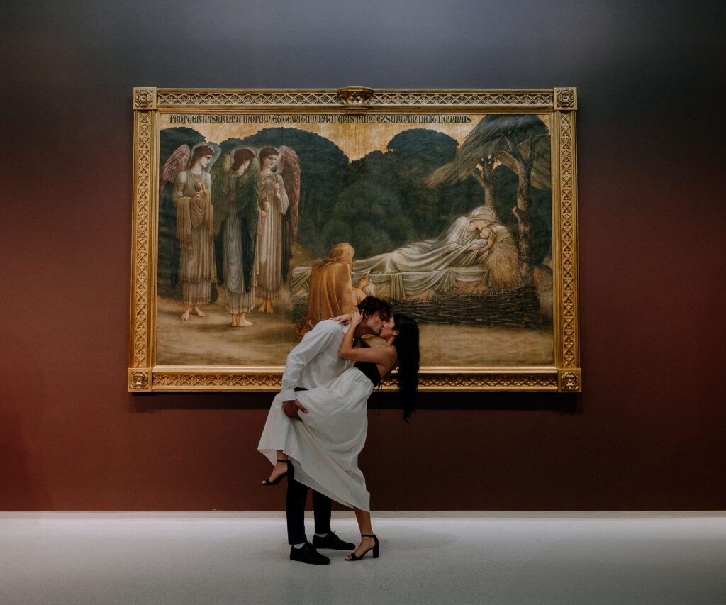 couple in front of a painting at carnegie museum of art photographed by pittsburgh wedding photographer