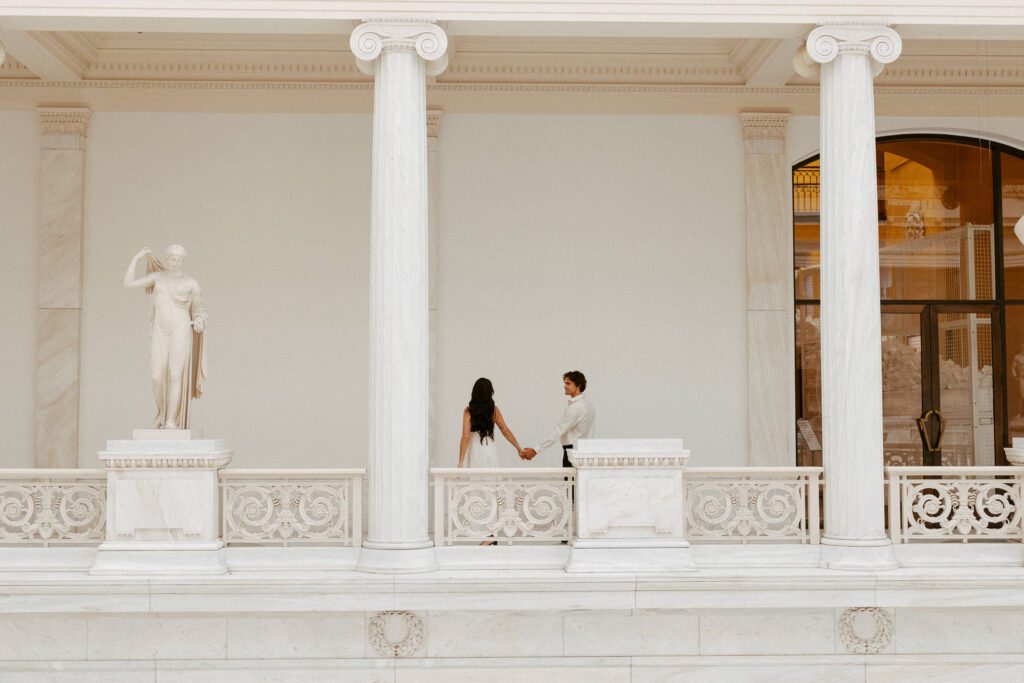 couple walking in carnegie museum of art photographed by pittsburgh engagement photographer