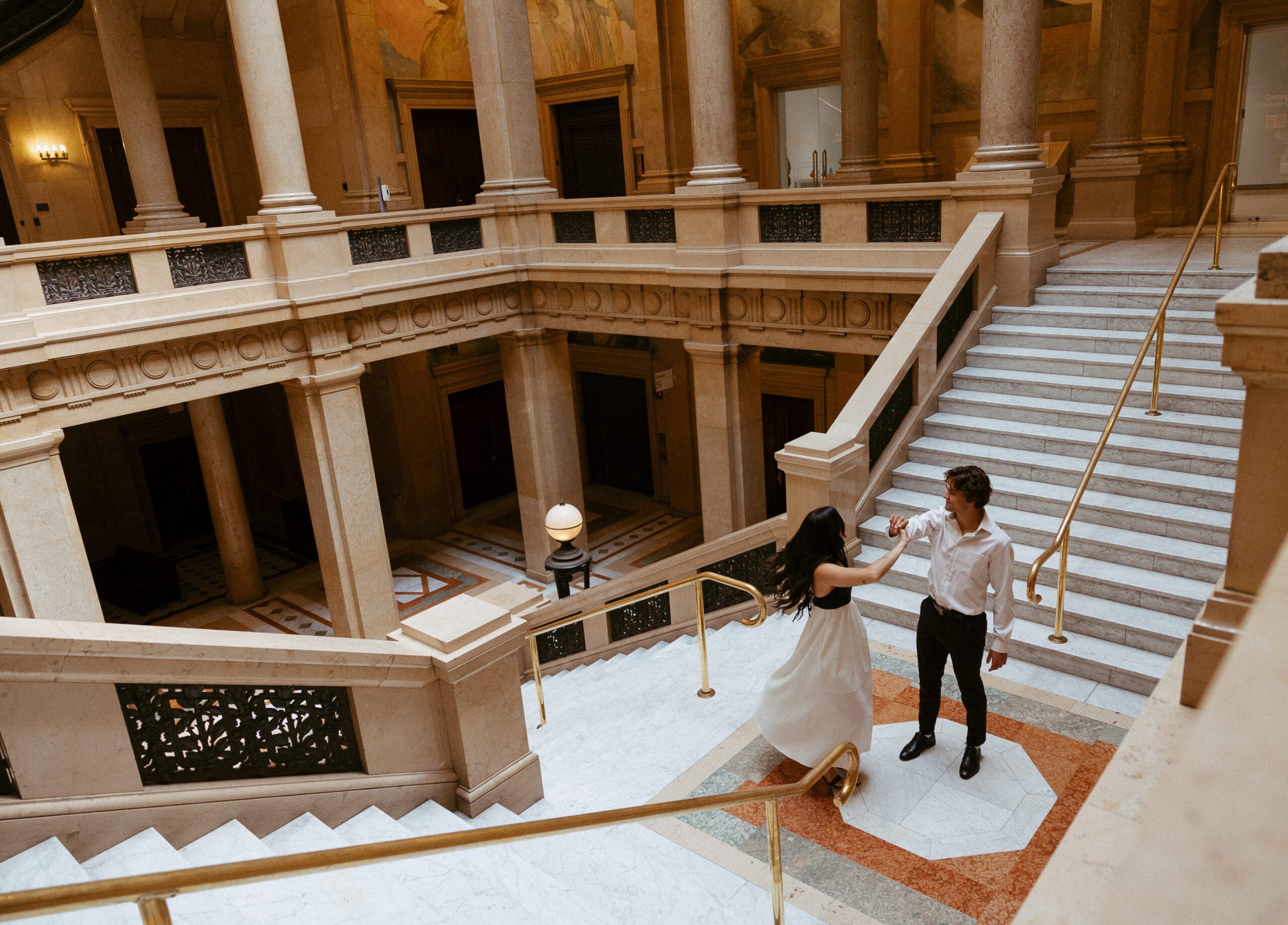 engagement photos of a couple at carnegie museum of art in pittsburgh taken by pittsburgh engagement photographer