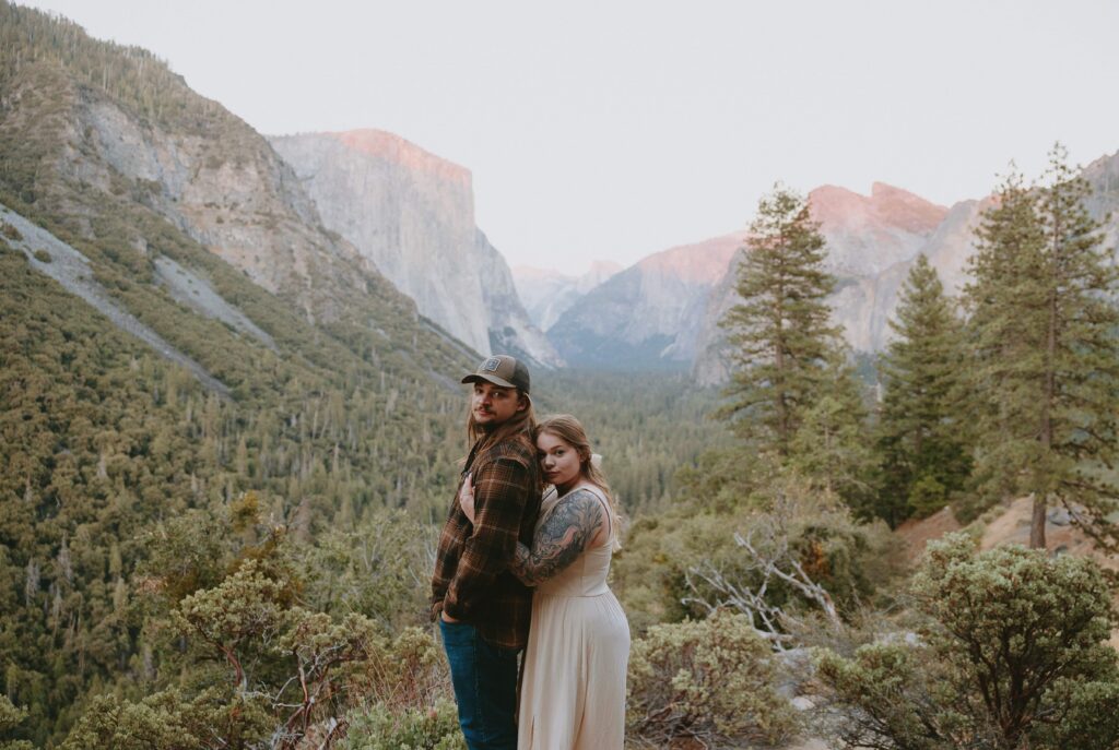 couple with serious faces at tunnel view in yosemite national park taken by yosemite engagement photographer