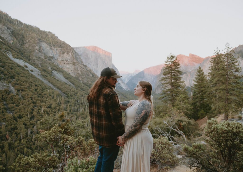 couple looking at each other in yosemite valley taken by yosemite engagement photographer