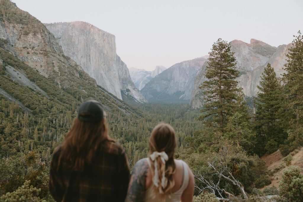 couple standing together looking out at tunnel view taken by yosemite elopement photographer