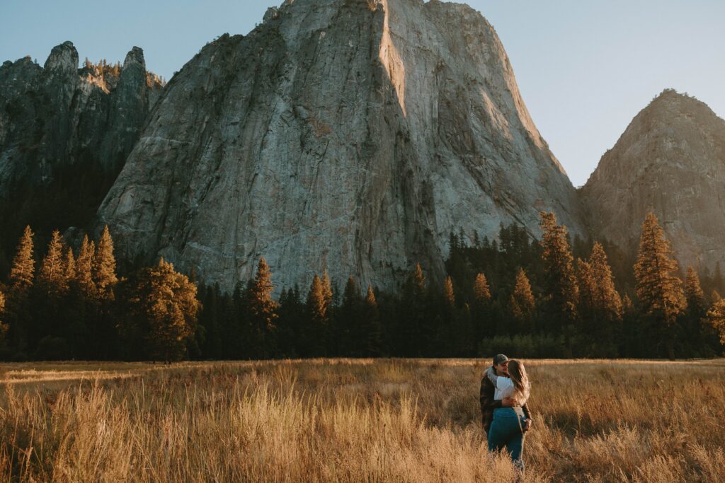 couple standing in el capitan meadow in yosemite taken by yosemite wedding photographer