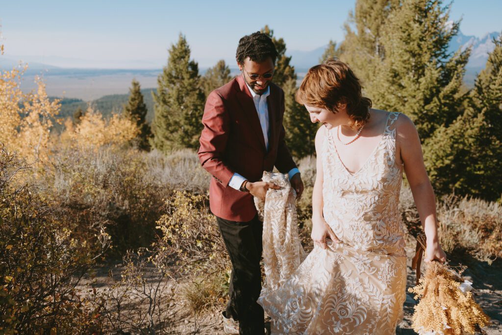 Couple at an overlook in the afternoon in wedding attire in Grand Teton National Park