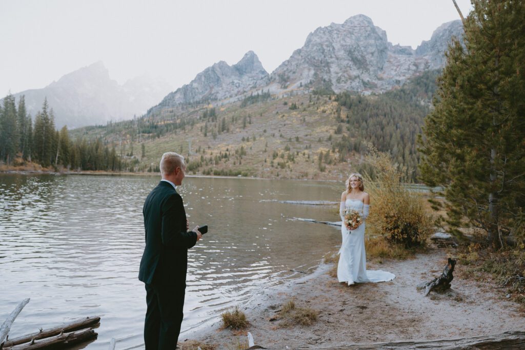 Grand Teton National Park elopement with a couple smiling at each other at sunset in the Tetons.