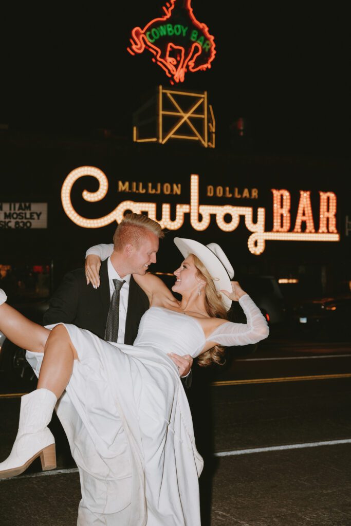 eloping couple exploring jackson on their elopement day holding hands