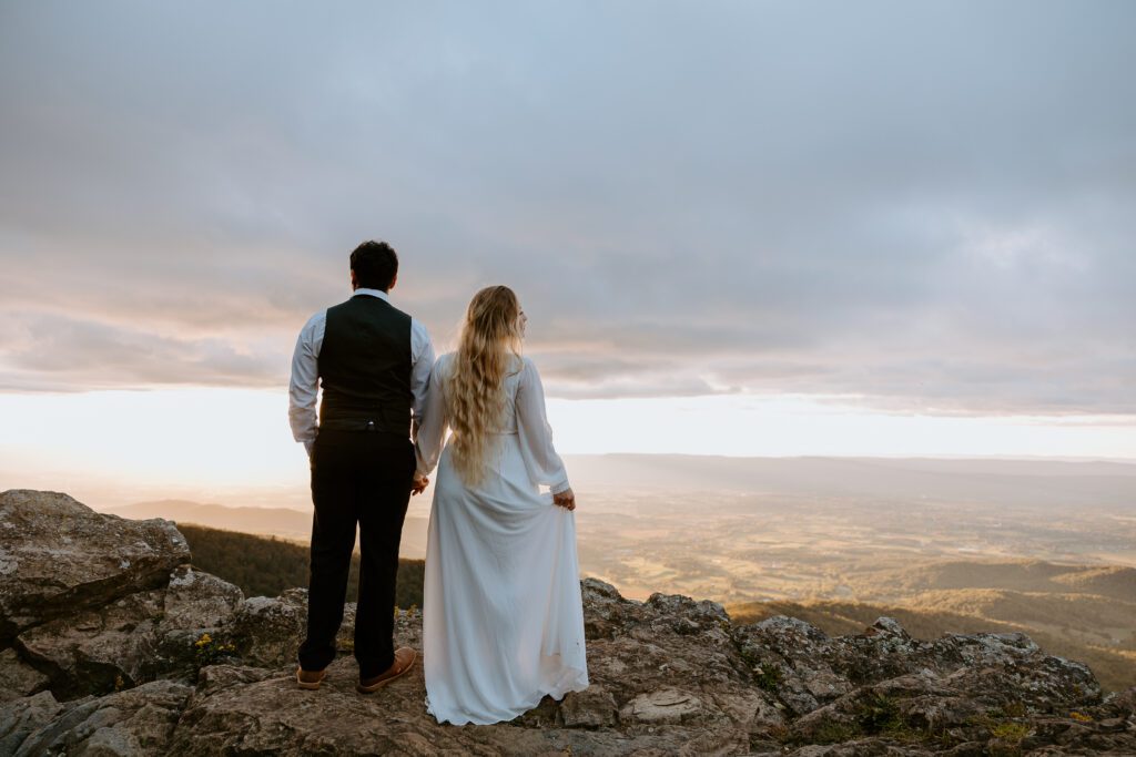 A couple at Little Stony Man in Shenandoah, hiking elopement in September.