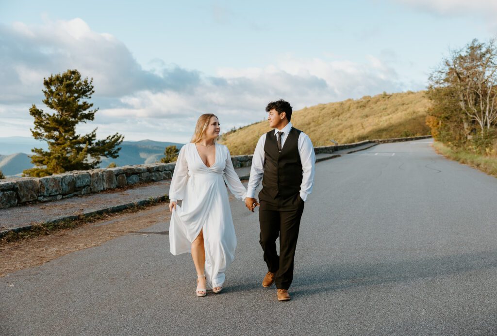 Couple walking during autumn Shenandoah elopement.