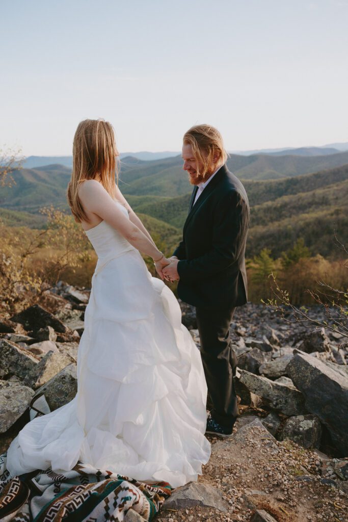 couple holding hands and exchanging vows in shenandoah national park