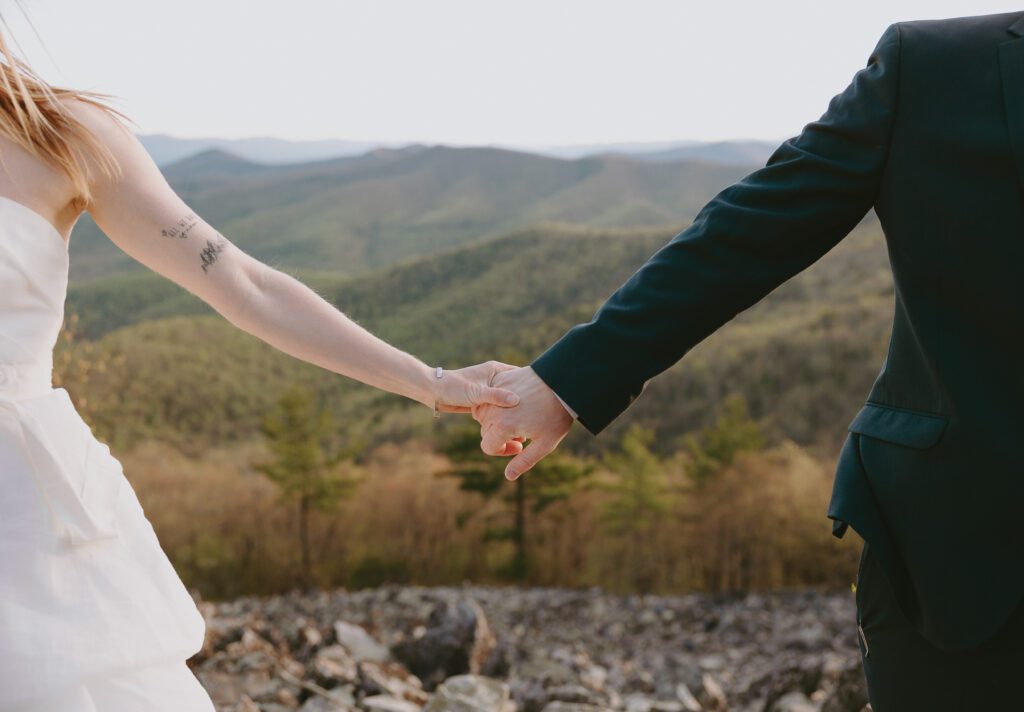 couple holding hands on their wedding day in virginia
