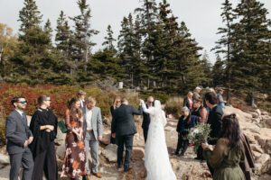 bride and groom walking after their wedding ceremony in acadia national park